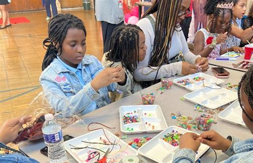 students making bracelets